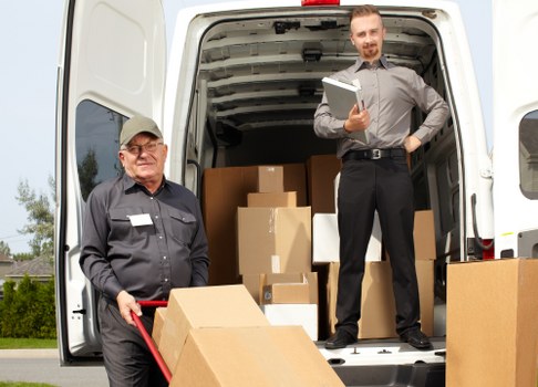 Same day removal team working in Islington with moving boxes and furniture