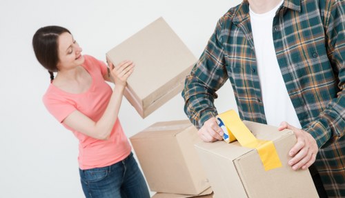 Professional removals team planning a move in an Islington residential street
