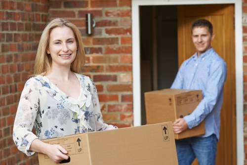 Packed cartons prepared for a move in an Islington flat