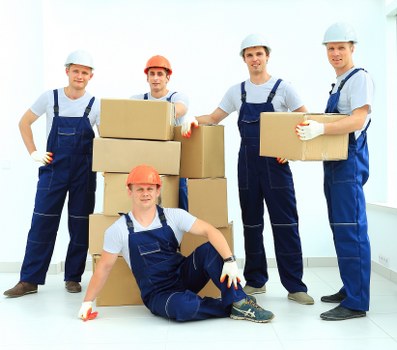Removal team planning a house move on an Islington residential street