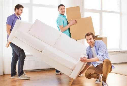 Removal crew navigating a flat move with stairs in Islington