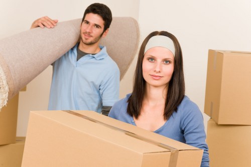 Moving team unloading household items at an Islington property