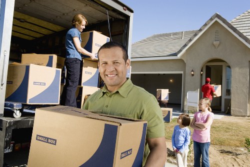 Unpacking and organising belongings in an Islington property