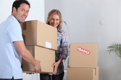 Packing fragile household items for a move in Islington